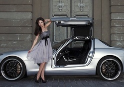 Model Katja Runiello posing with a Mercedes AMG