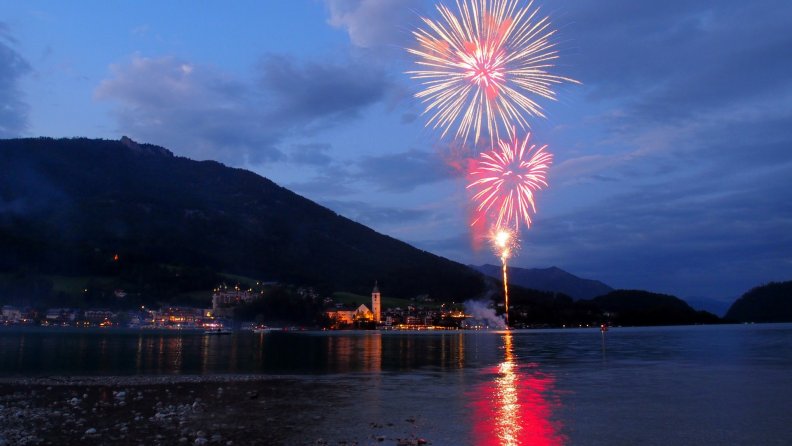 fireworks over an austrian lakeside town