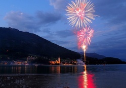 fireworks over an austrian lakeside town