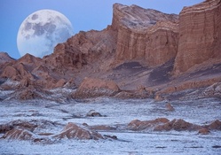 wonderful moon behind desert mountains