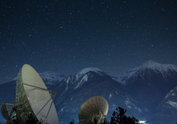satellite dishes under a beautiful starry night