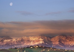 moonset over tuscan landscape