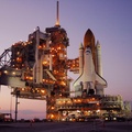 Space Shuttle Discovery on launch pad at night