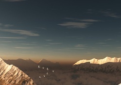 cranes in a v formation over mountains
