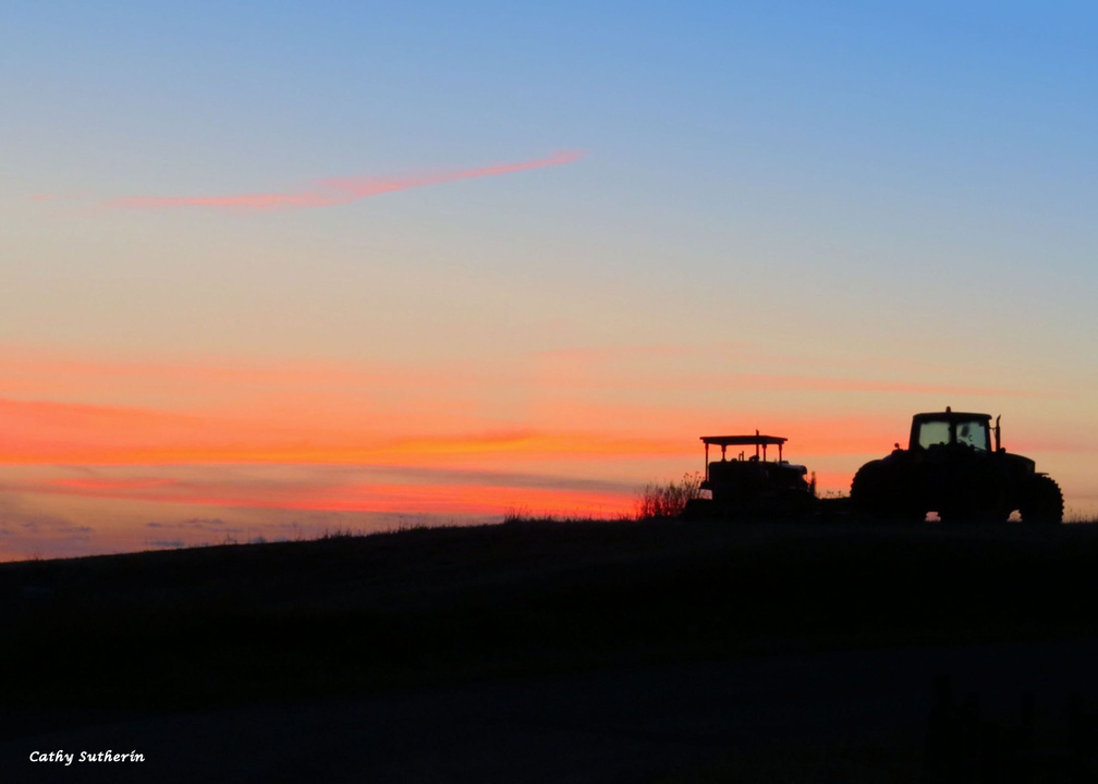 Farm Tractors in the Sunrise
