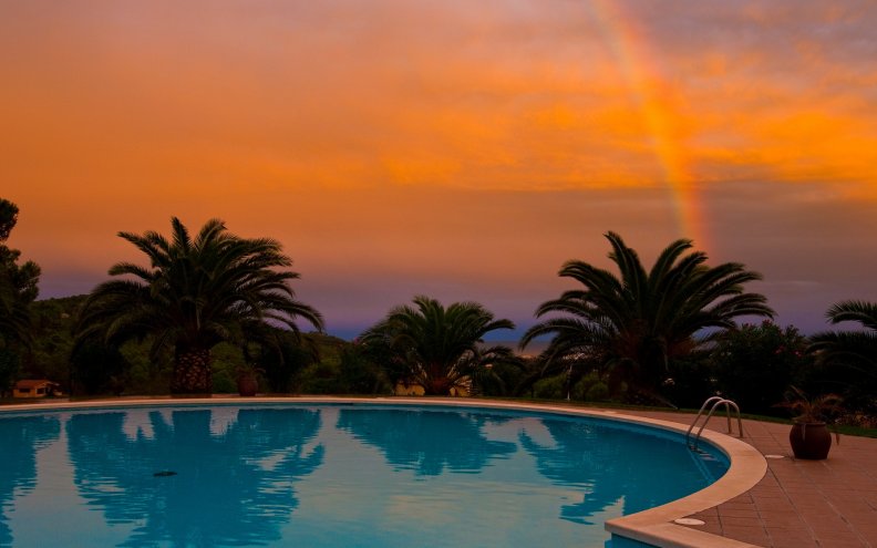 rainbow_and_sunset_over_pool.jpg