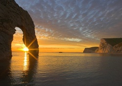durdle door rock formation in england at sunset