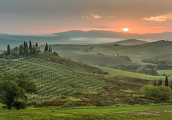 sunset over a tuscan landscape