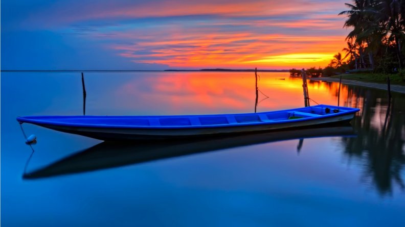 A loveiy boat at sunset river
