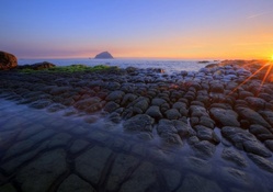 sunrise over fantastic rocky shore hdr