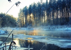frozen river in morning fog
