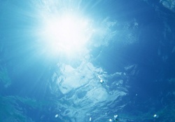 Underwater surface waves and sunlight