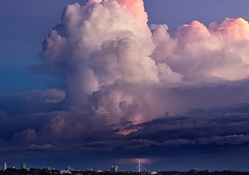 massive cloud above a lightning storm