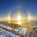 a solar halo over a city in winter