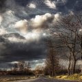 superb clouds over countryside road hdr