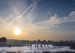 playing hockey on a frozen pond