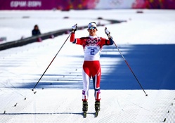 Marit Bjoergen celebrates winning gold