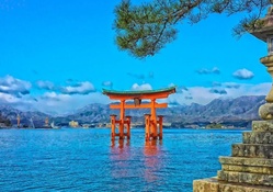 itsukushima shrine in a japanese bay hdr
