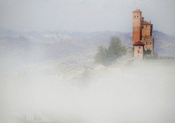 fog over castle in piemonte italy