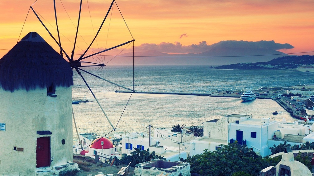 windmill on the island of mykanos at sunset