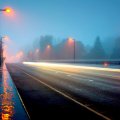 a highway bridge in a foggy rainy night