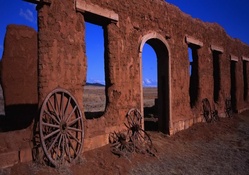 cart wheels against old fort ruins