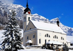 beautiful mountain church in winter