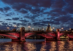 bridge in red lights over the thames