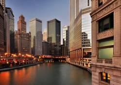 the chicago river through the city at dusk