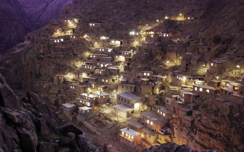 ancient village on a cliff in evening