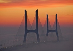 fabulous modern bridge towers in fog