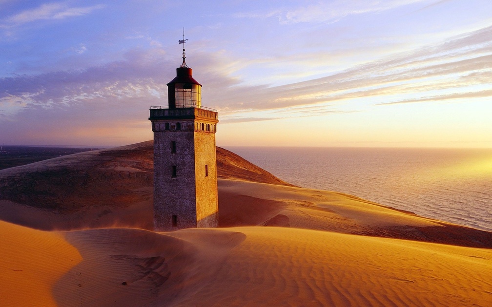 shifting sands around rubjerg knude lighthouse in denmark