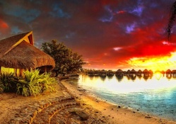 bungalows resort on moorea on a wondrous sunset