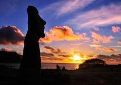 moai silhouette on easter island at sunset