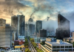 morning fog rising from a cityscape hdr