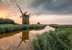 old windmill along a canal