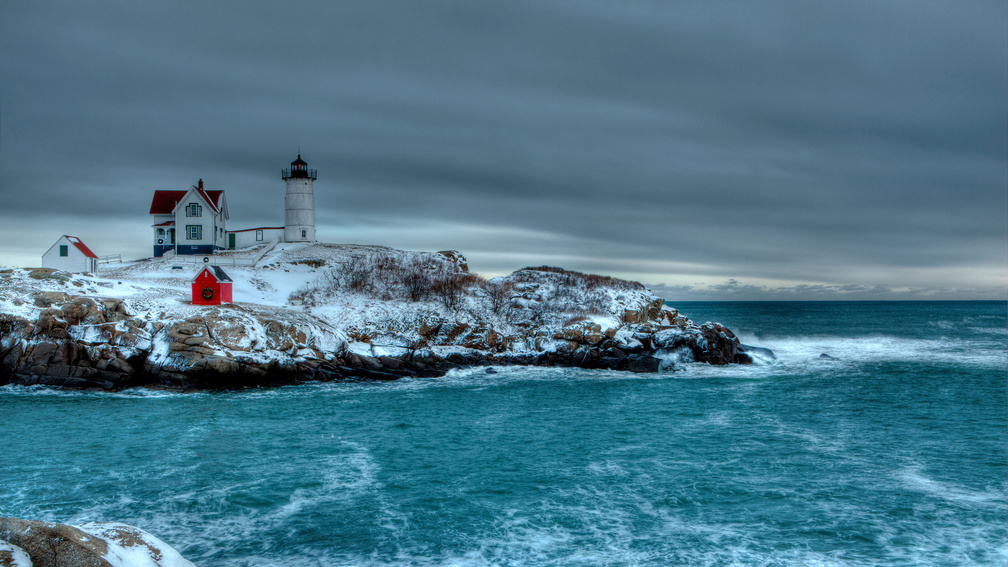 lighthouse on a cape in winter