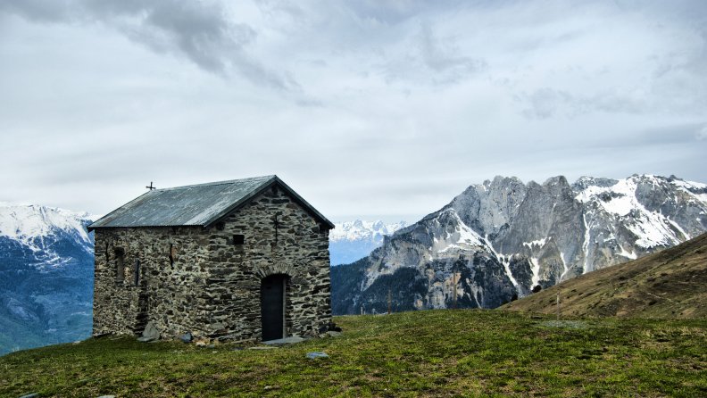 fantastic_stone_chapel_in_the_mountains.jpg