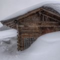 snowbound log cabin in the mountains hdr