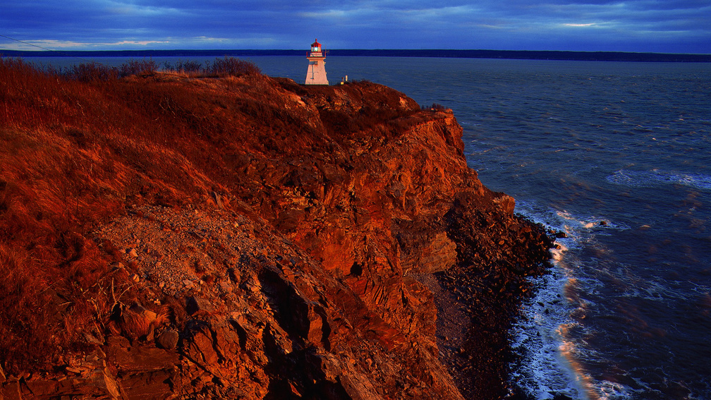 lighthouse on a red cape