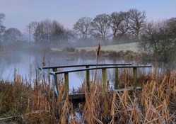 bridge out of order on a misty pond