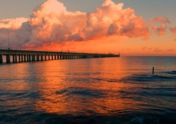 pier under orange cream sunset