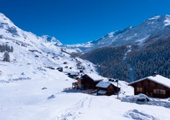 lodges on a mountainside in winter