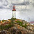 wonderful lighthouse on a rocky hill hdr