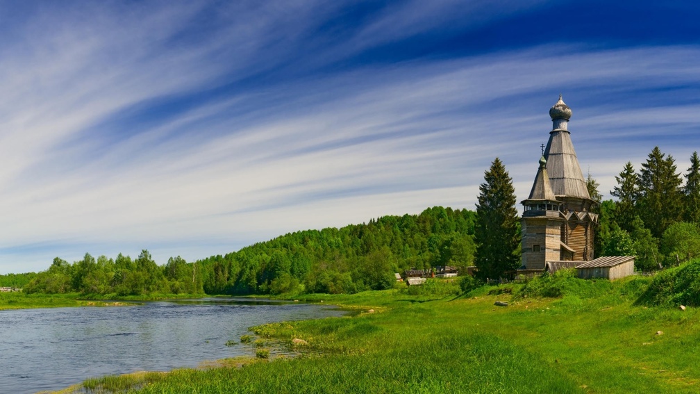 wooden church by a river