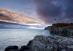 lighthouse atop seacoast cliffs