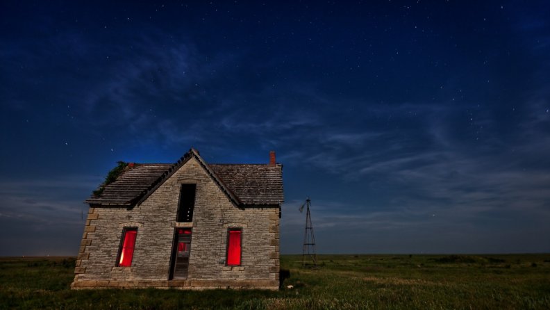 haunted_house_on_the_prairie_at_night.jpg