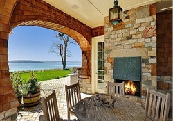 back_porch with fireplace and a view on the sea