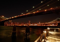 under the brooklyn bridge at night