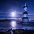 awesome lighthouse in a moonlit night